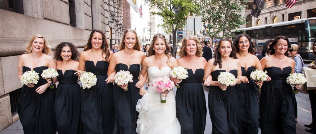 Bride and bridesmaids marching down Fifth Avenue before a University Club wedding
