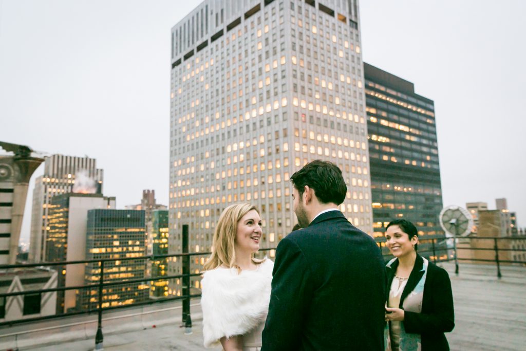 Bride and groom exchanging vows at a Grand Hyatt Hotel rooftop wedding