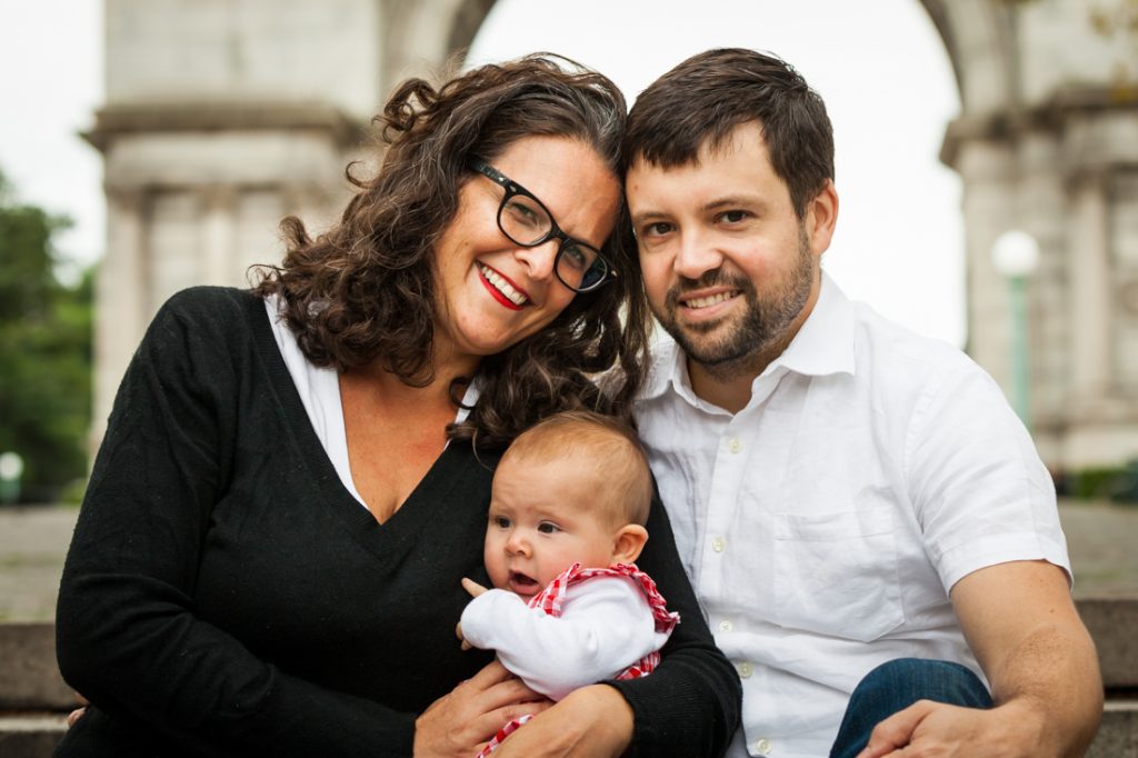 Parents with baby at Grand Army Plaza by Brooklyn baby photographer, Kelly Williams
