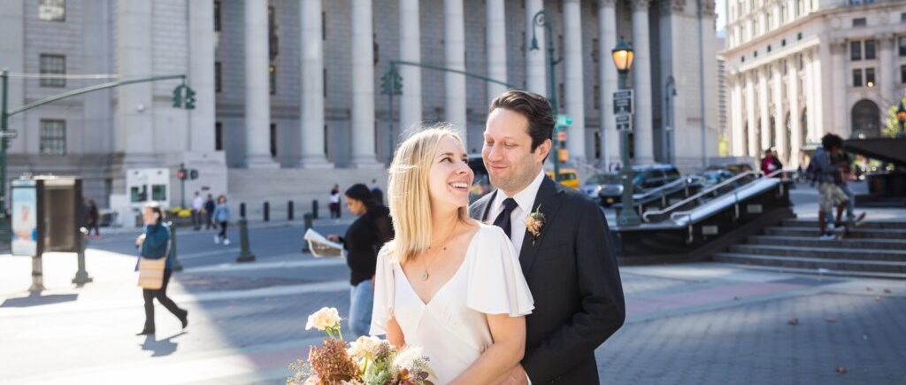 Bride and groom portrait in front of courthouse