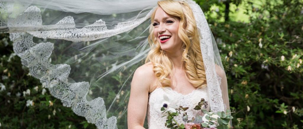 Bride with flowing veil at a Central Park Conservatory Garden wedding