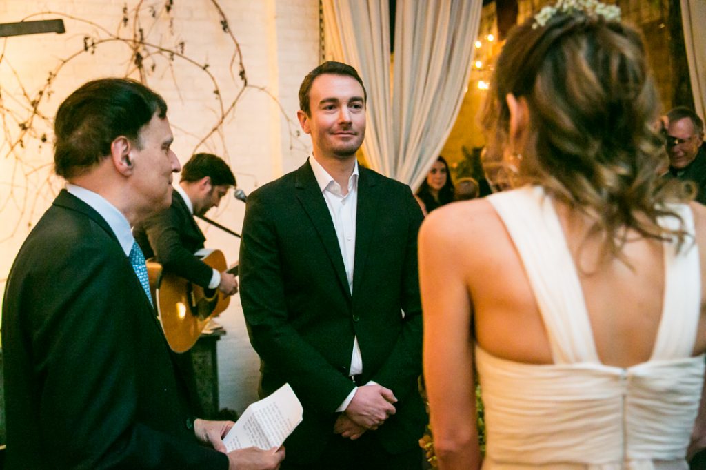 Bride and groom exchanging vows at an Atelier Roquette wedding