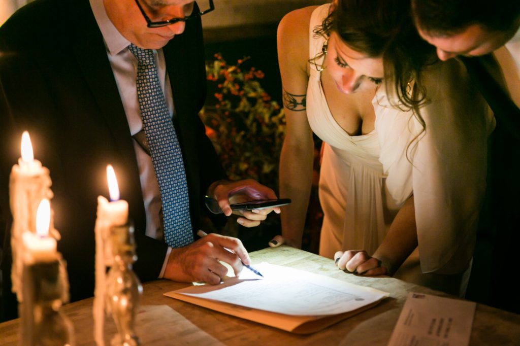 Bride and groom signing marriage license