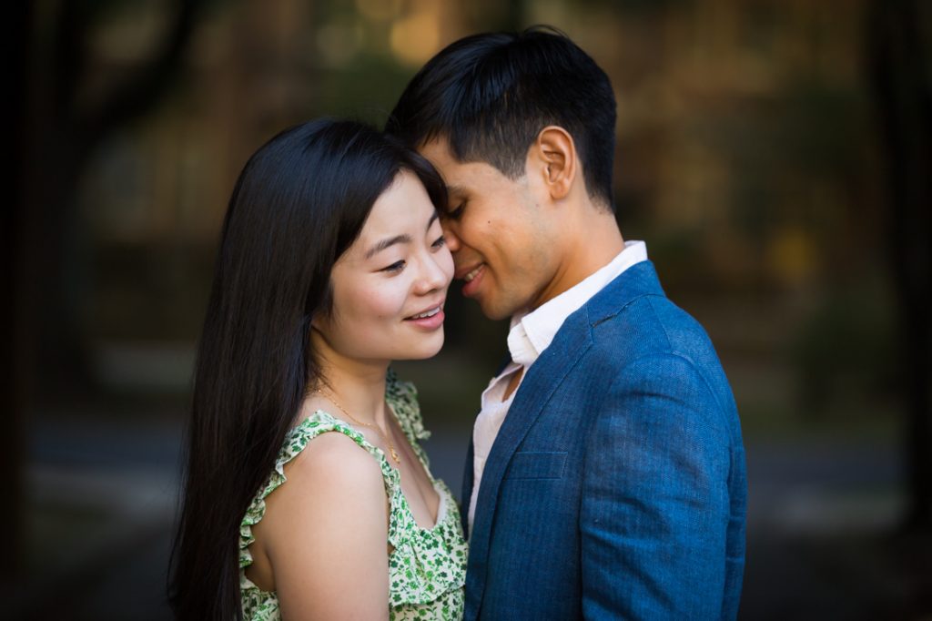 Color photo of engaged couple hugging