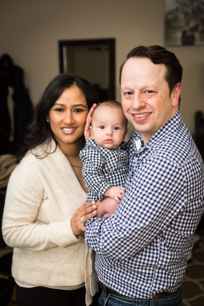 Parents holding baby boy for a Forest Hills baby portrait