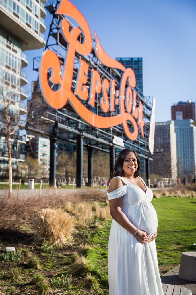 Mother to be in front of Pepsi Cola sign during a Long Island City maternity portrait session
