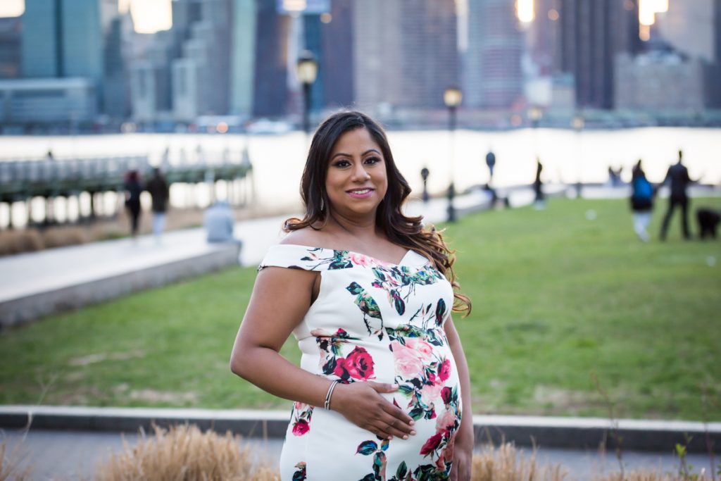 Mom to be with hand on stomach at Gantry Plaza State Park
