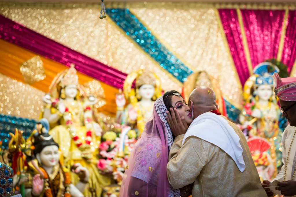 Father kissing bride on cheek after sagai ceremony