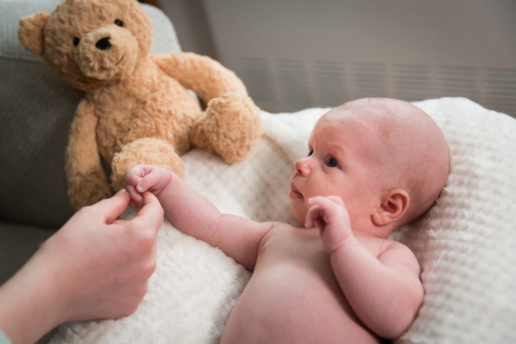 Upper West Side newborn portrait of baby with teddy bear
