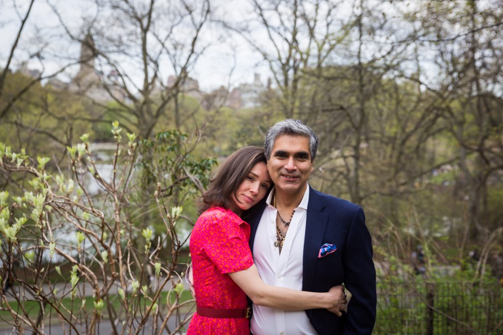 Couple hugging in forest for an article on NYC family portrait location ideas