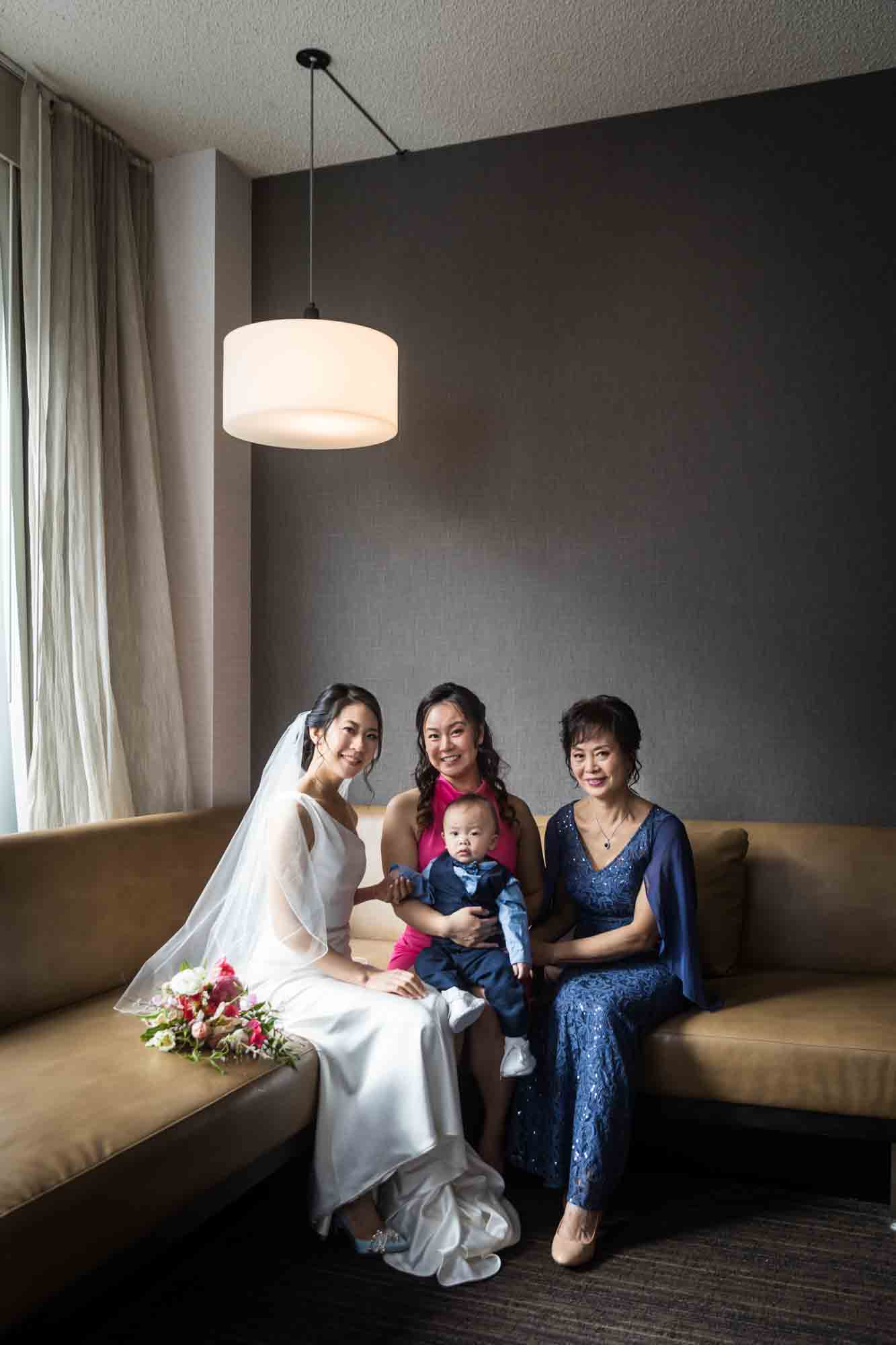 Bride and family sitting on couch