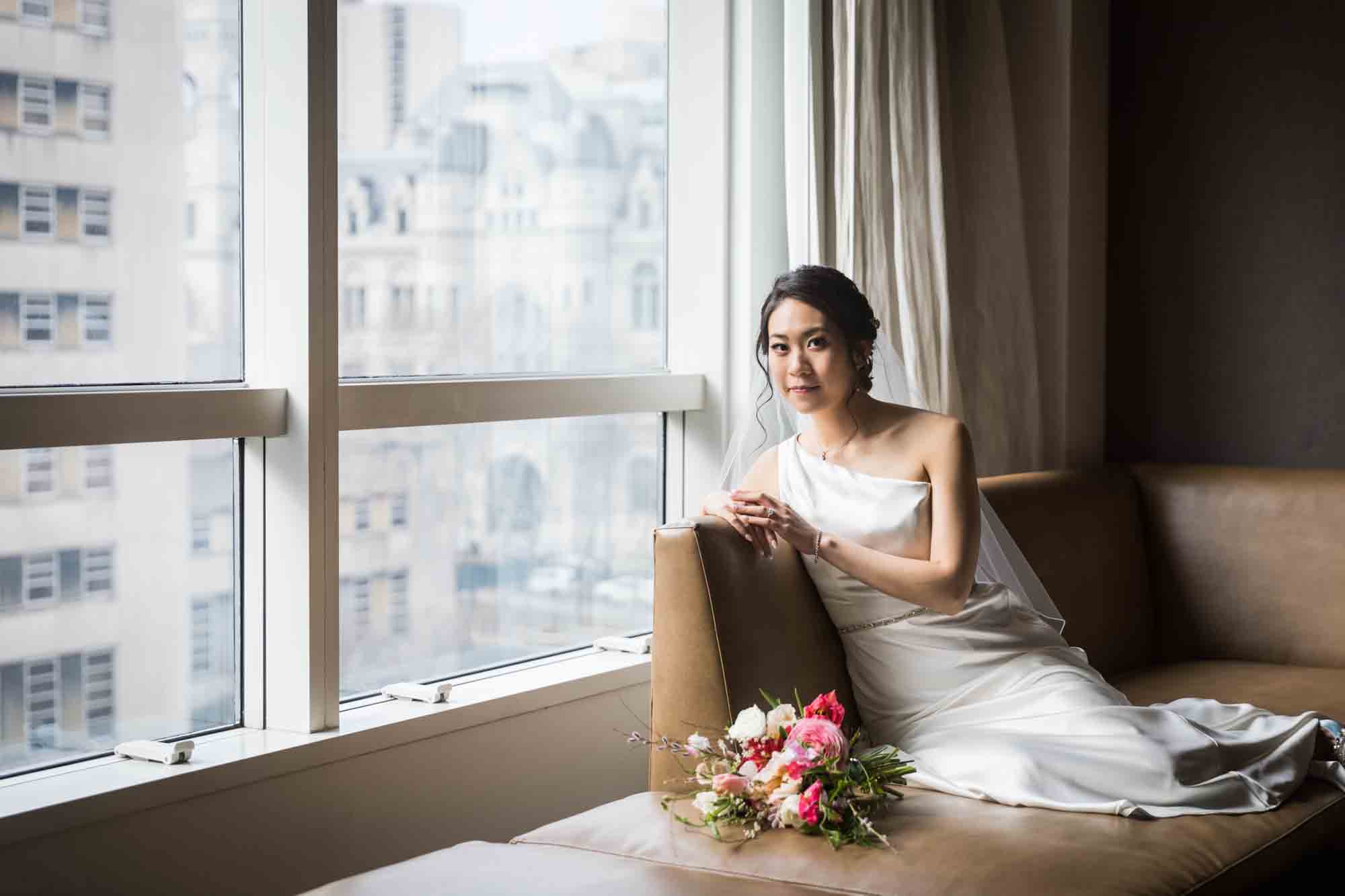 Bride laying on couch looking into camera