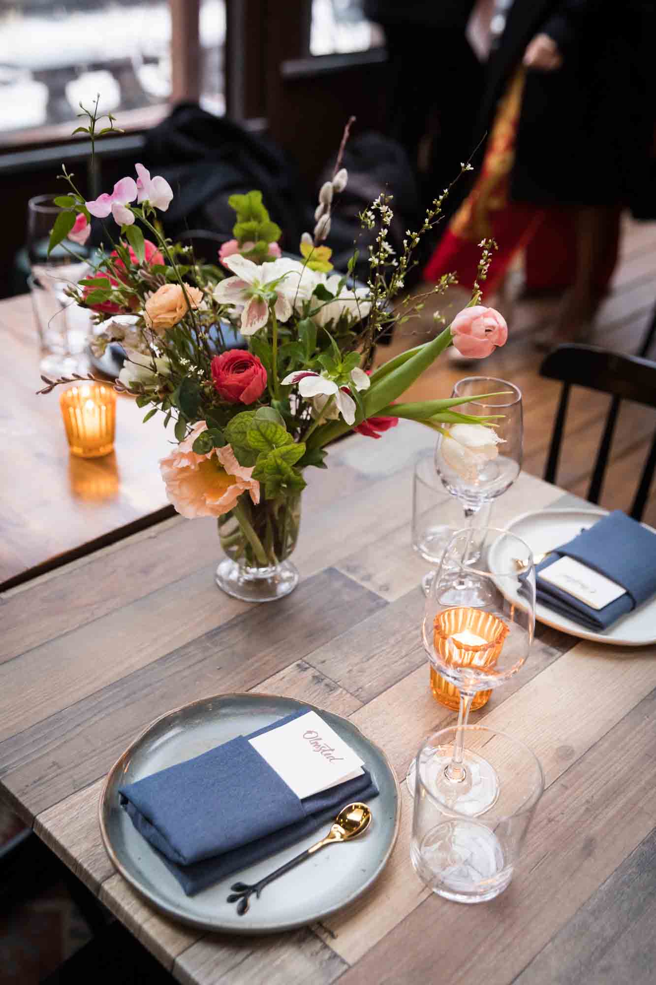 Table setting and flower centerpiece at a Brooklyn restaurant wedding