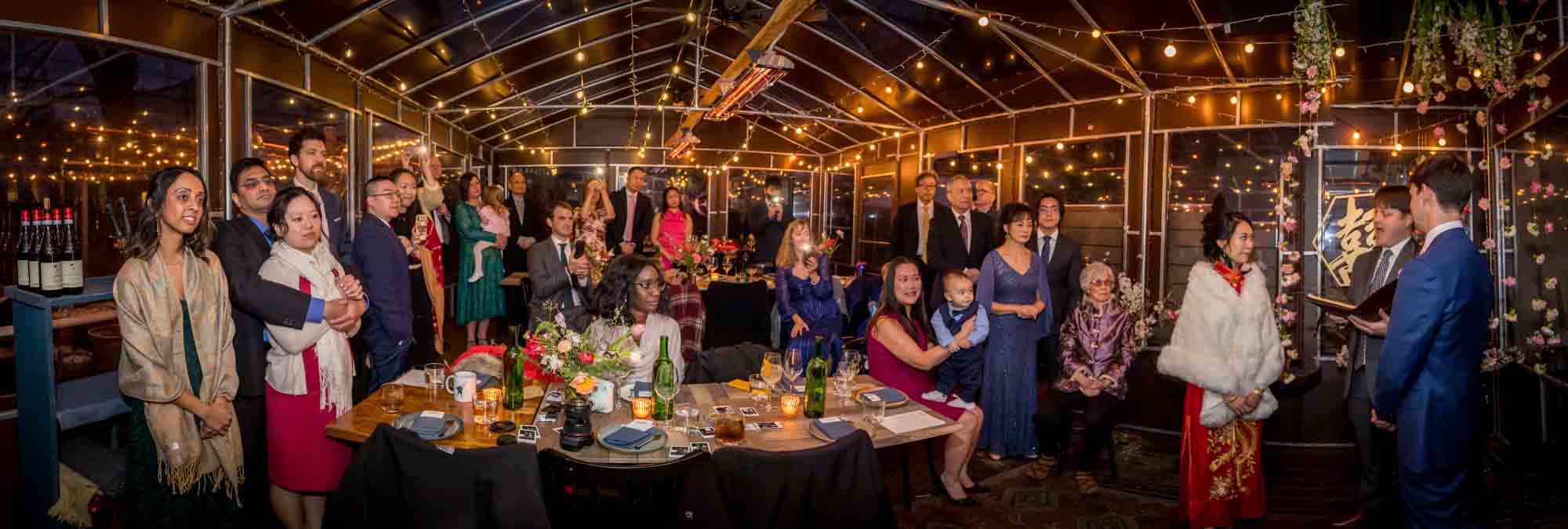 Panorama of guests enjoying a Brooklyn restaurant wedding