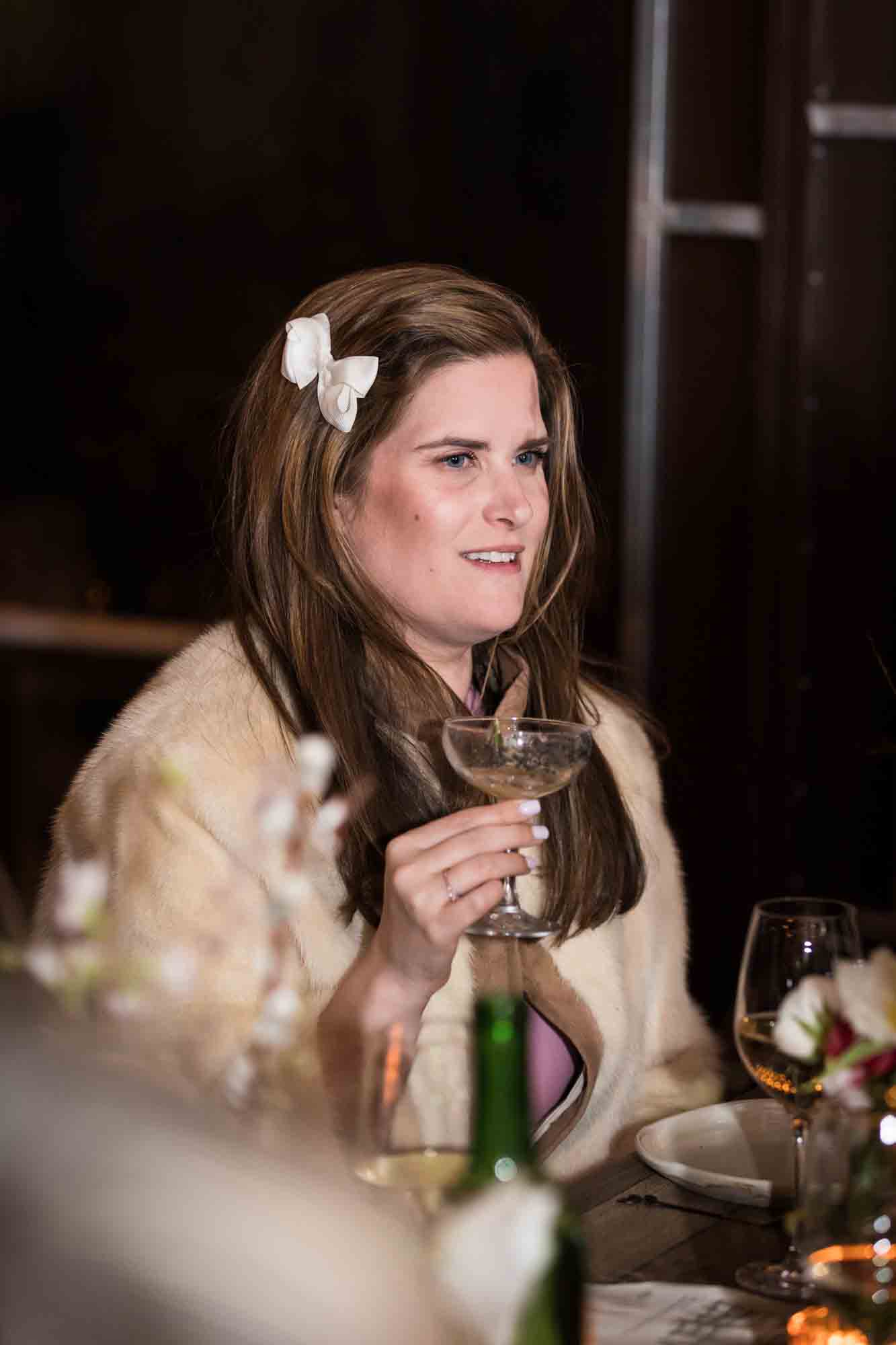 Female guest holding champagne glass