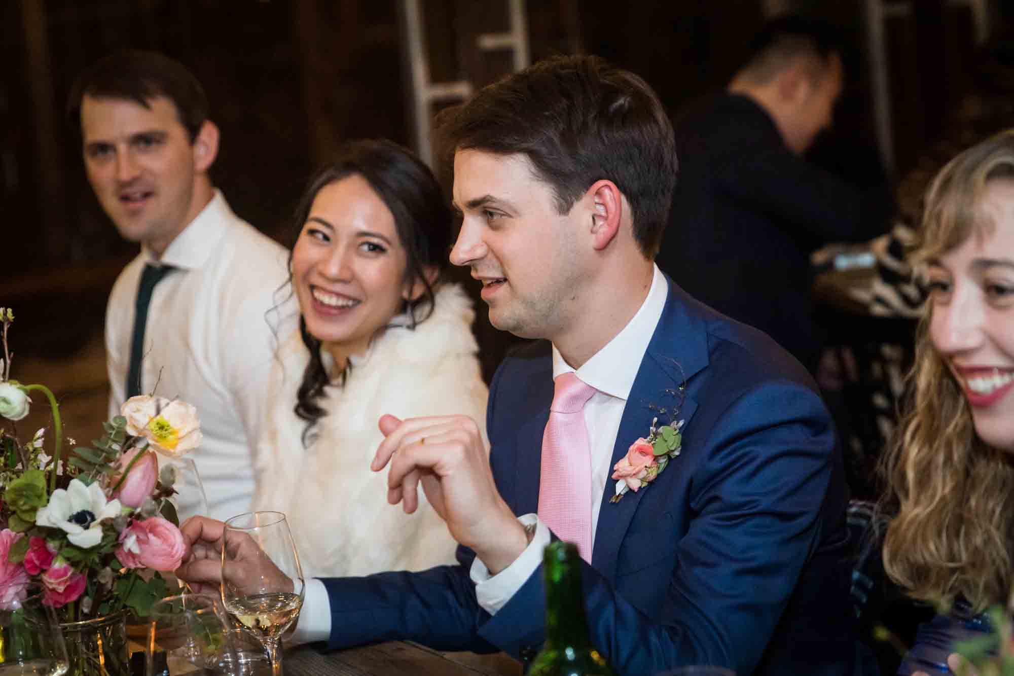Bride and groom laughing at a Brooklyn restaurant wedding