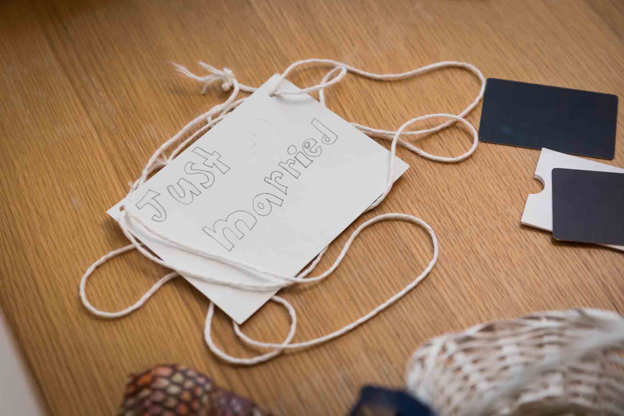 'Just Married' paper sign on table