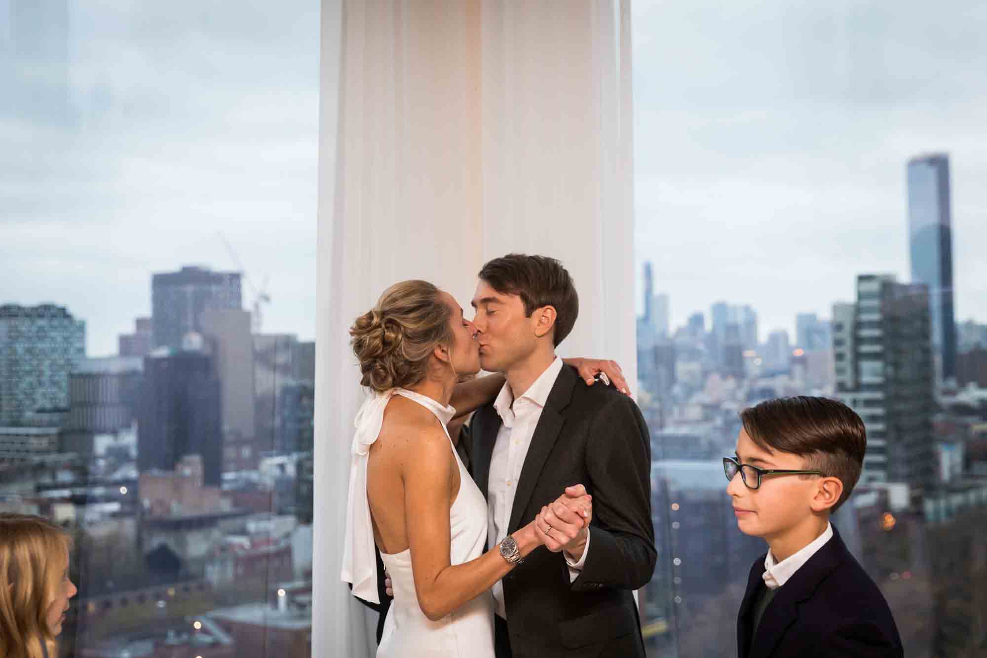 Bride and groom kissing after ceremony at a Public Hotel wedding