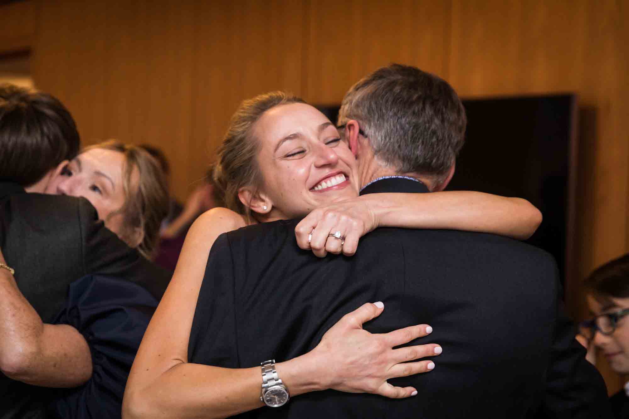 Bride hugging male guest at a Public Hotel wedding