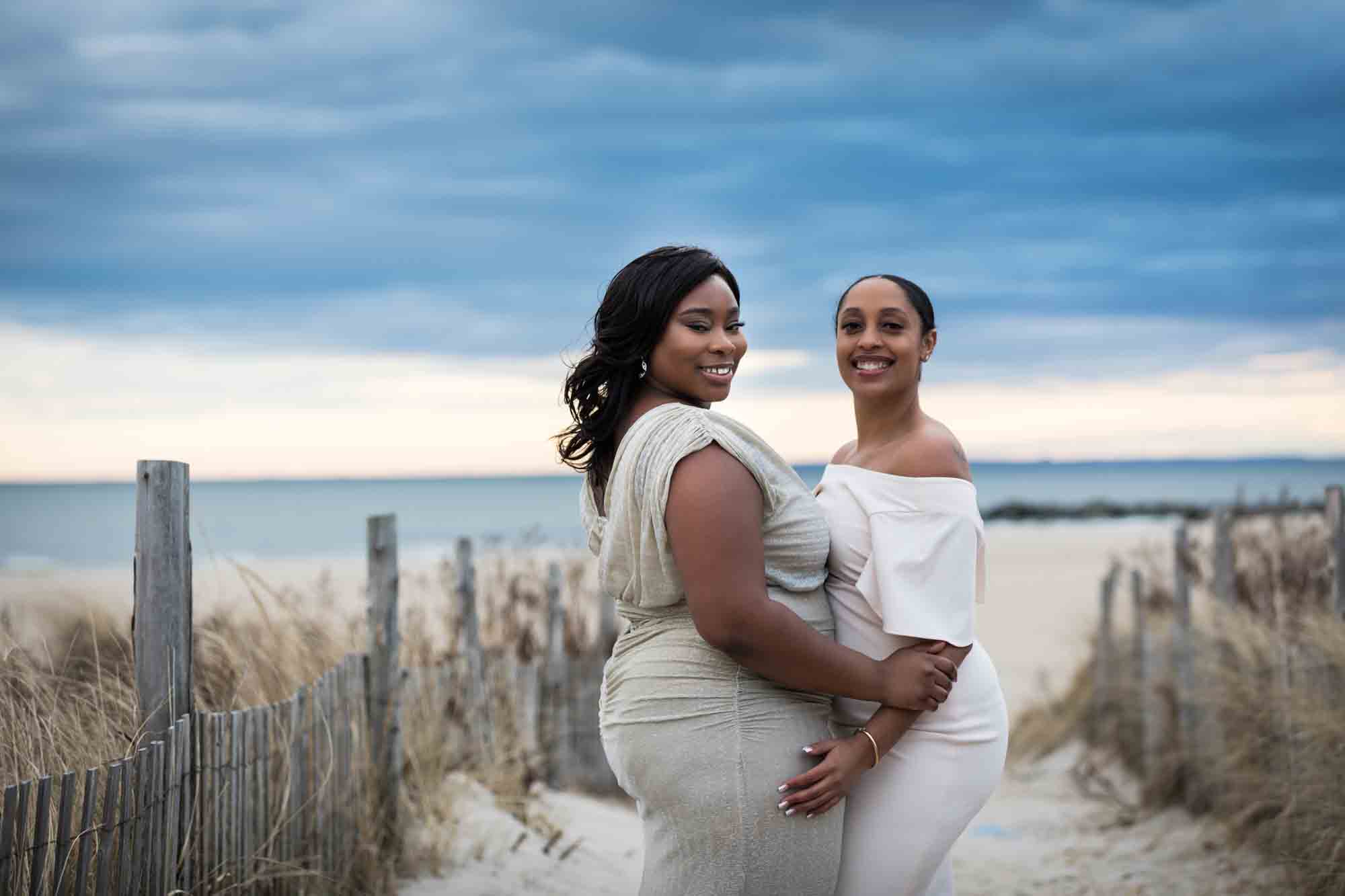 Two women hugging at the beach