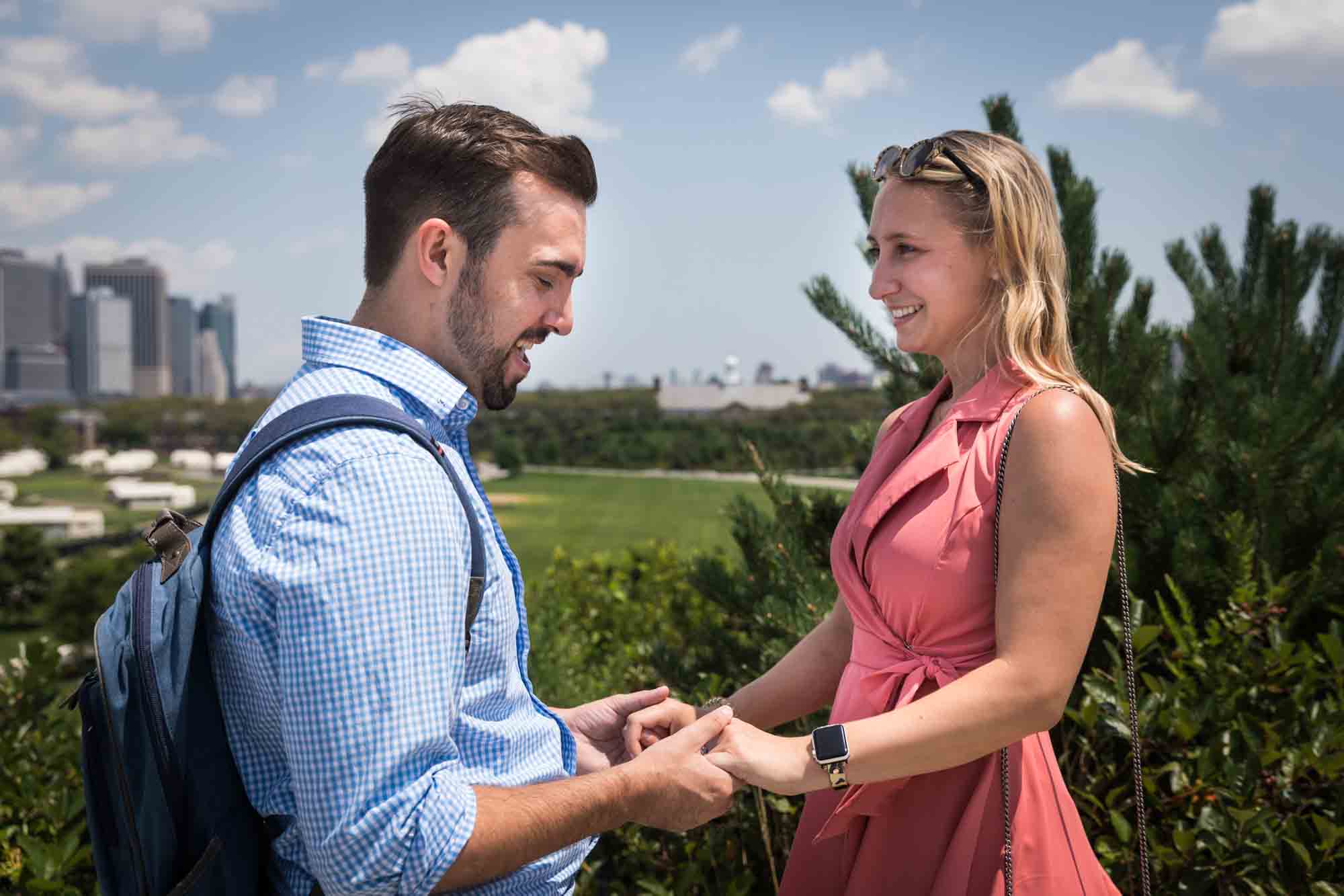 Couple holding hands for an article on how to propose on Governors Island