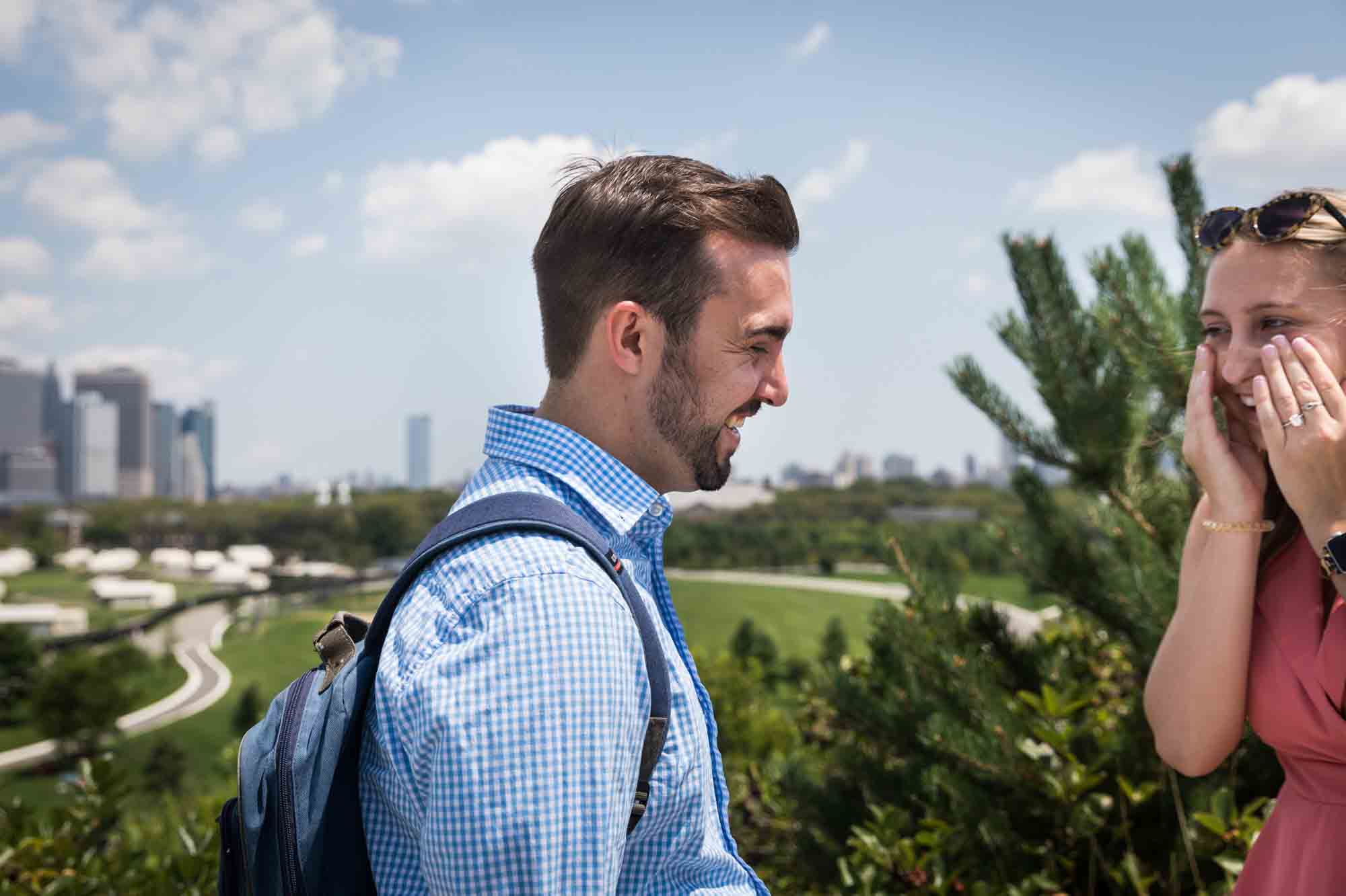 Man with backpack proposing for an article on how to propose on Governors Island