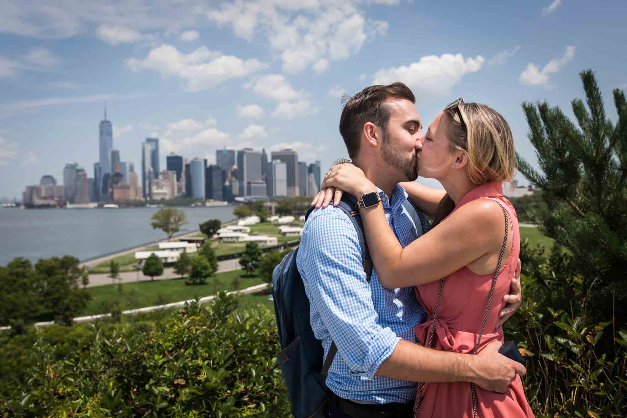 Couple kissing after proposal for an article on how to propose on Governors Island