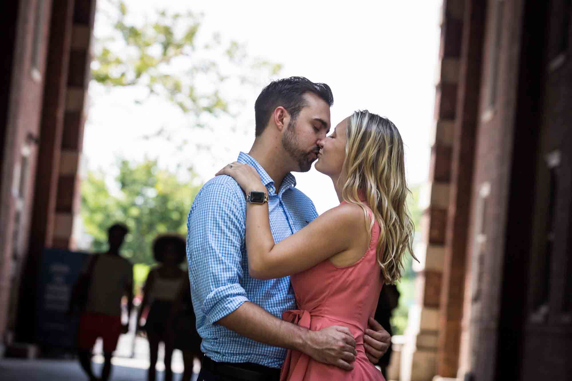 Couple kissing at Liggett Terrace for an article on how to propose on Governors Island