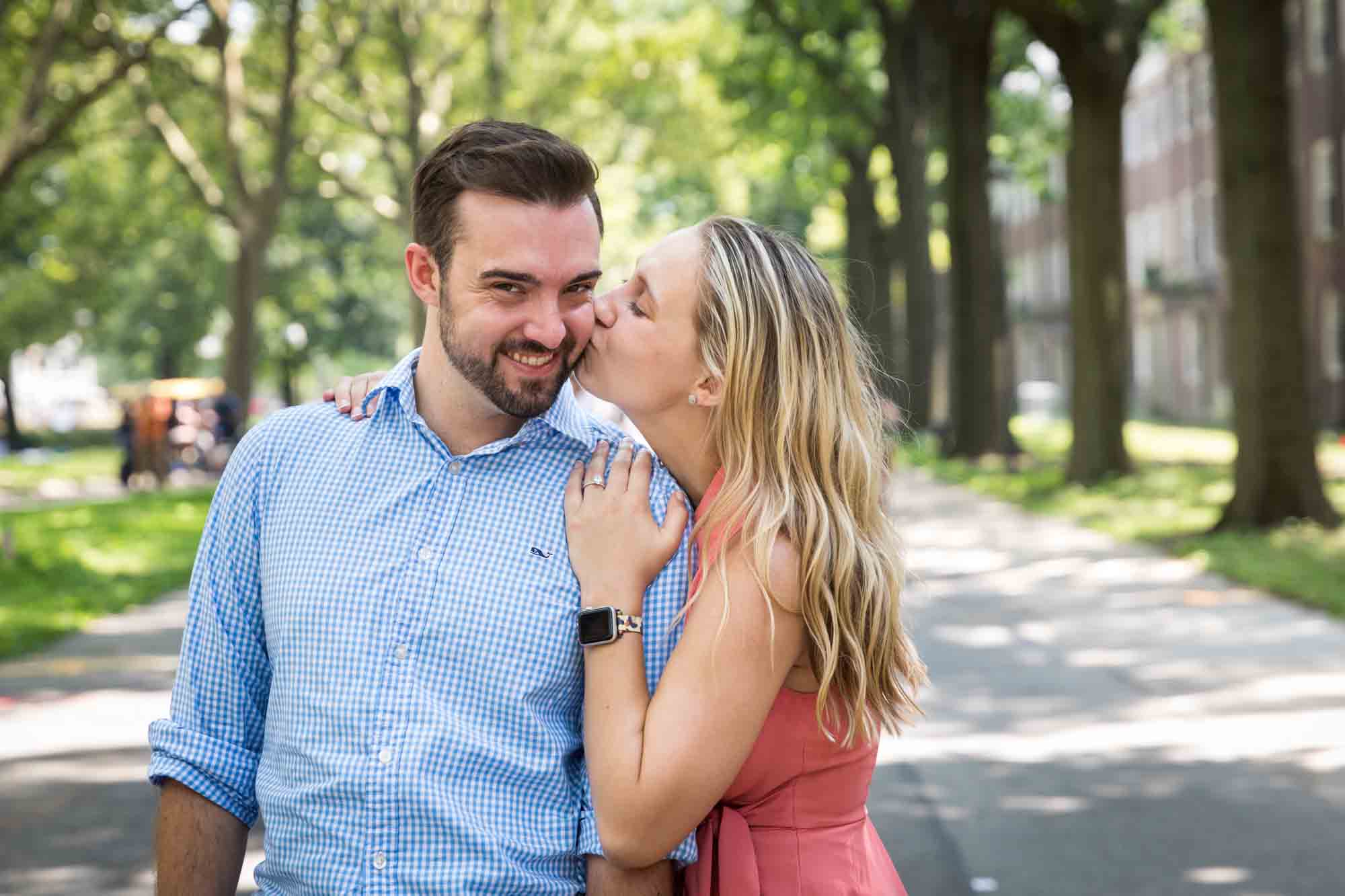 Woman kissing man's cheek on Colonels Row