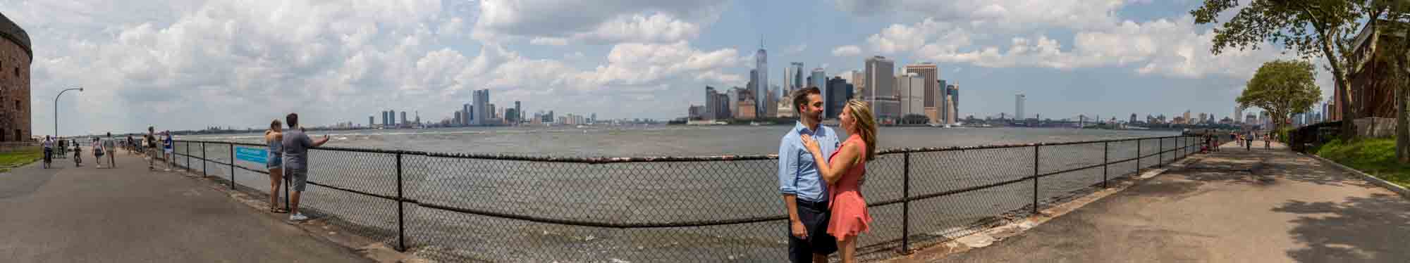 Panoramic view of couple in front of NYC skyline