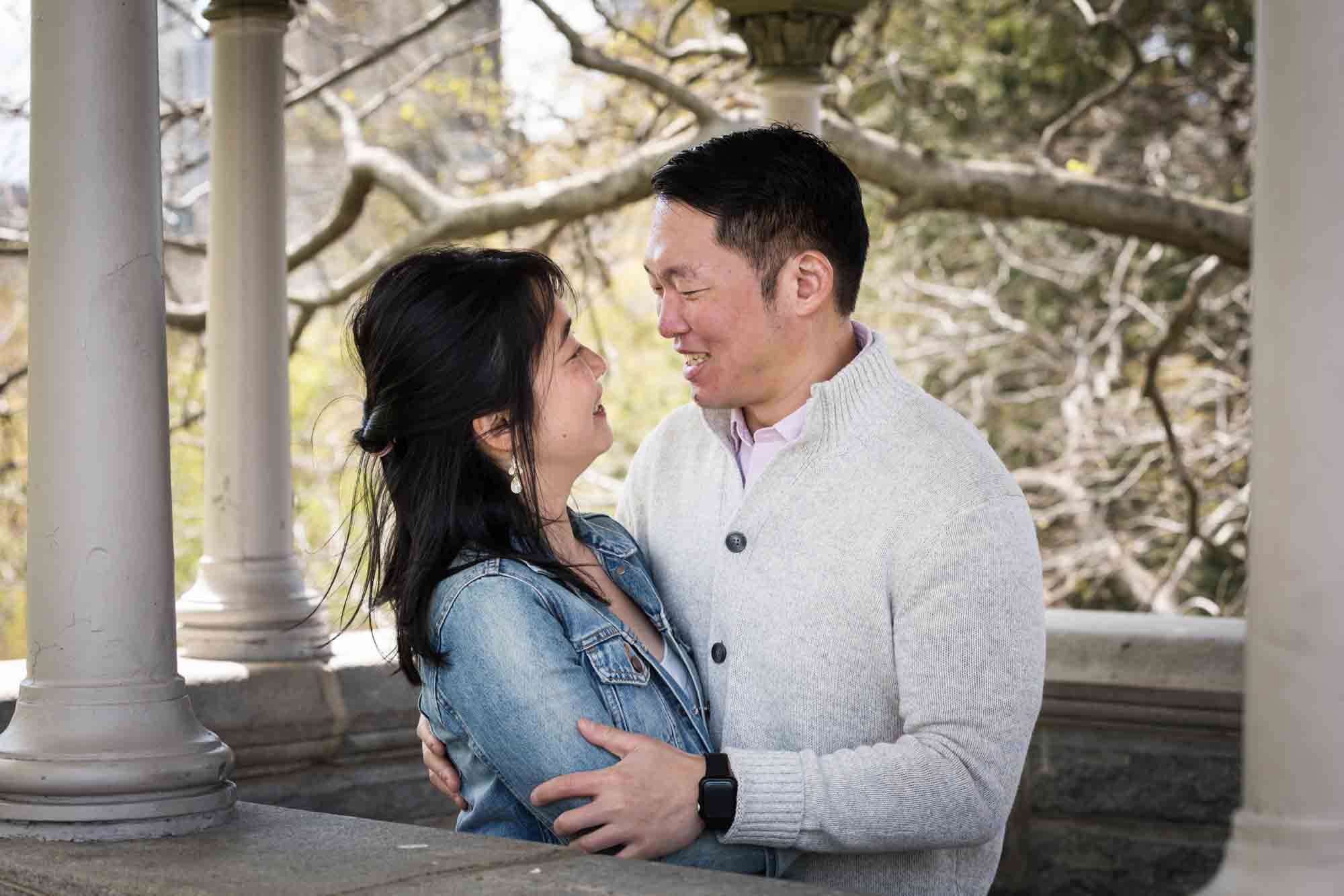 Couple hugging at Belvedere Castle in Central Park