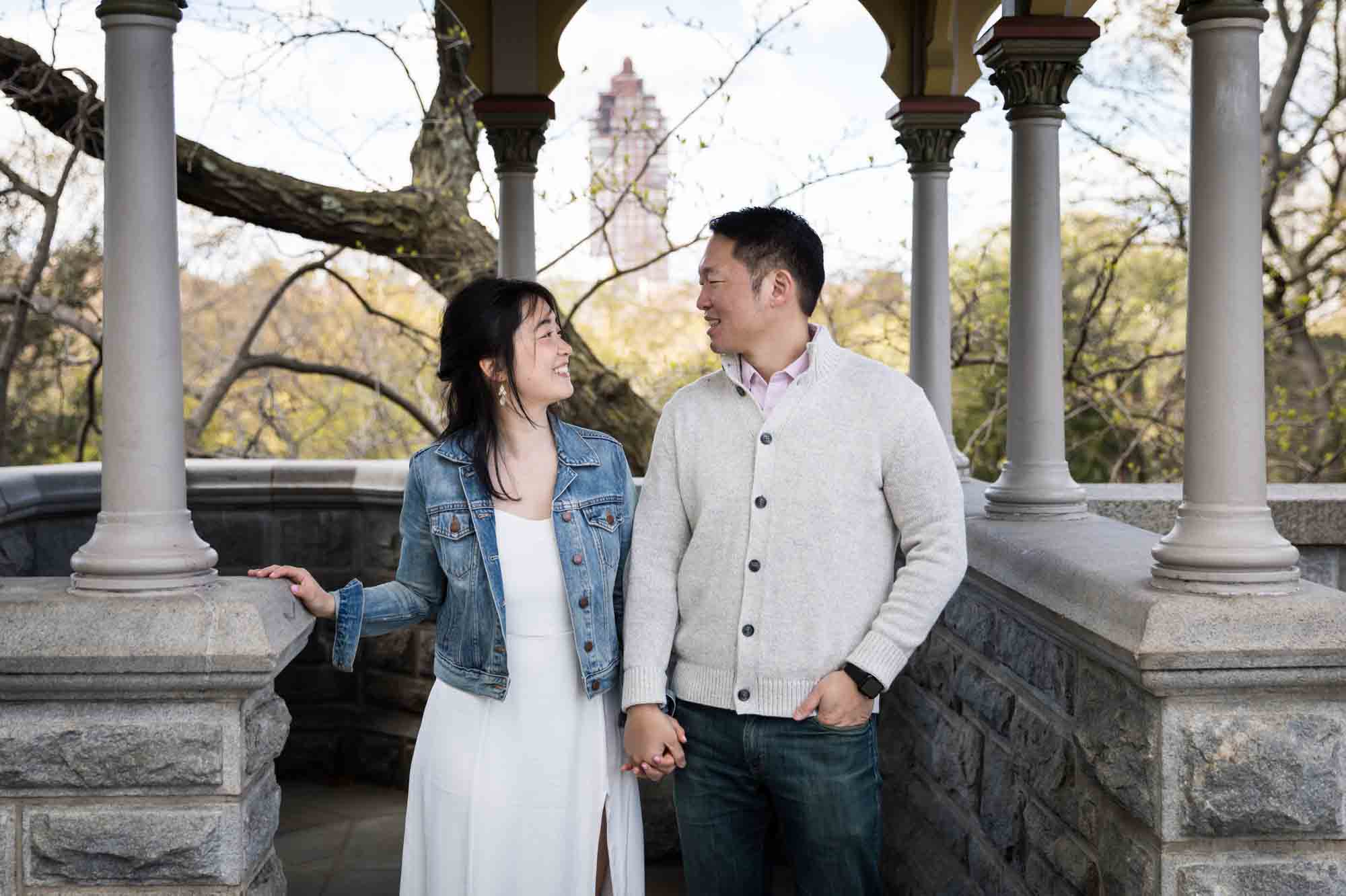 Couple holding hands at Belvedere Castle in Central Park