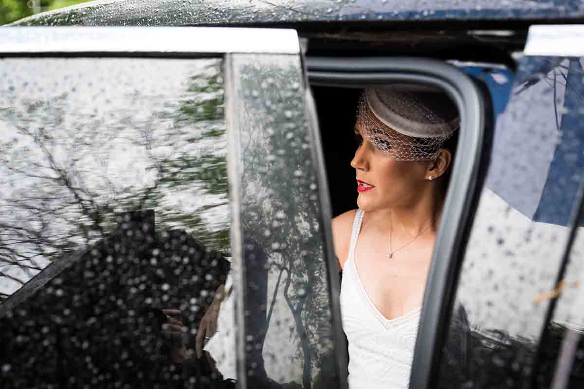 View of bride sitting in limousine