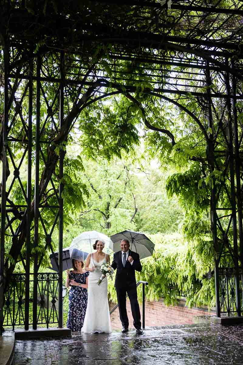 Central Park Wisteria Pergola wedding photos of bride and parents entering the pergola