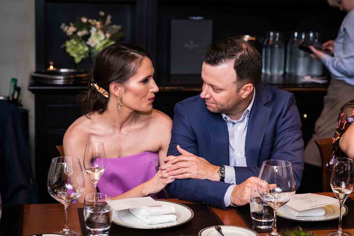 Gramercy Tavern wedding reception photos of couple holding hands at table