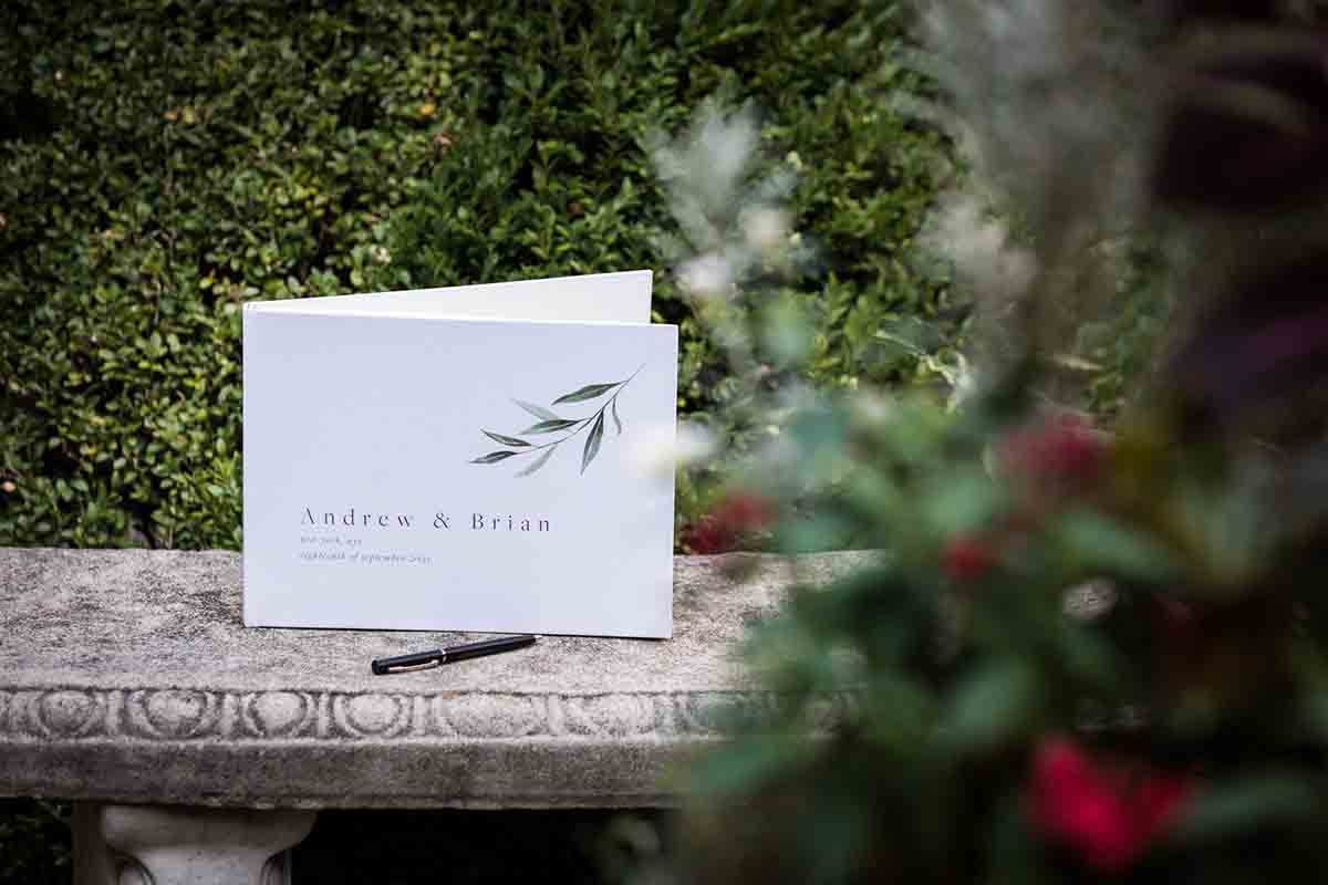White guest book on a stone bench
