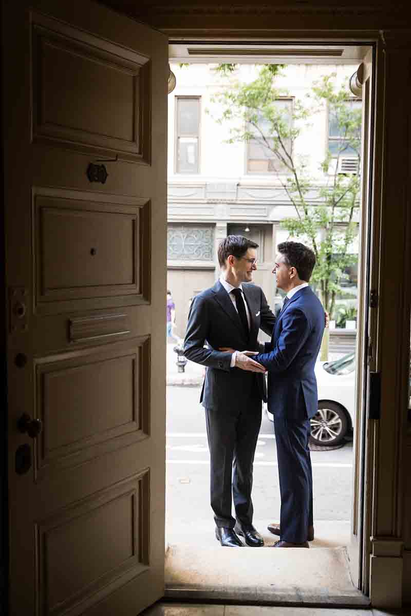 Merchant’s House Museum NYC wedding photos of two grooms seen through the main doorway