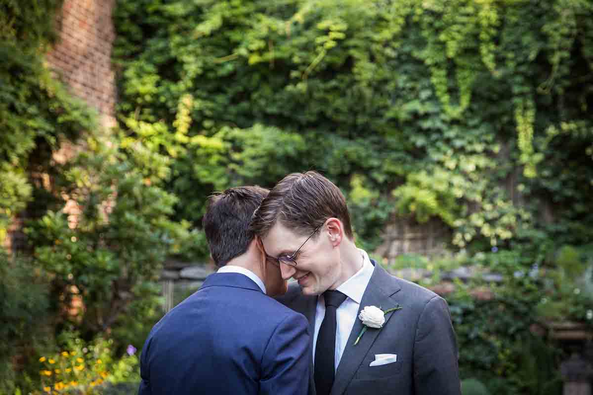 Merchant’s House Museum NYC wedding photos of two gay men hugging in the garden