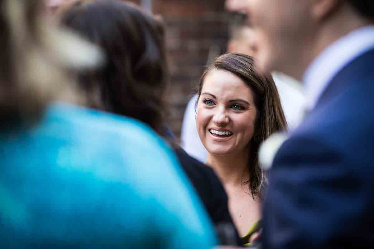 Merchant’s House Museum NYC wedding photos of female guest smiling during cocktail hour