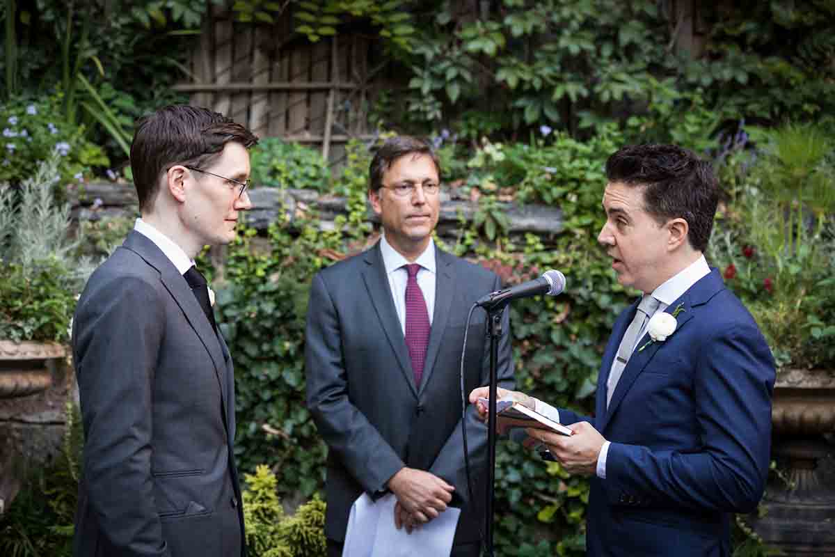 Merchant’s House Museum NYC wedding photos of grooms exchanging vows during gay wedding ceremony