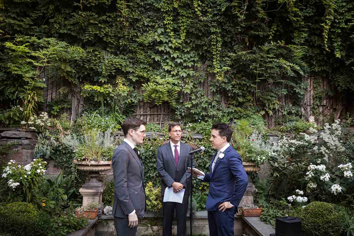 Merchant’s House Museum NYC wedding photos of two grooms exchanging vows