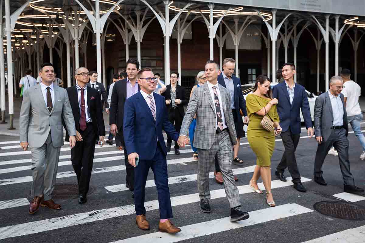 Wedding guests in crosswalk of NYC