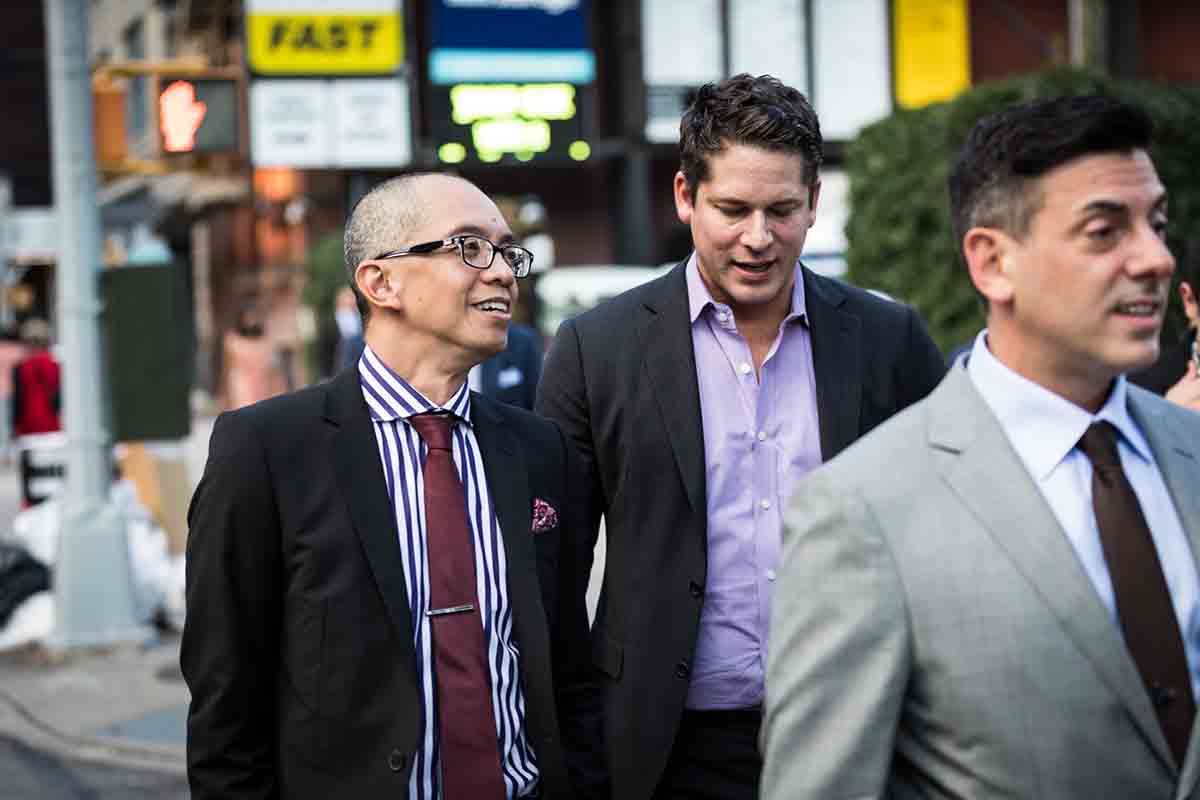 Wedding guests walking to ceremony in NYC