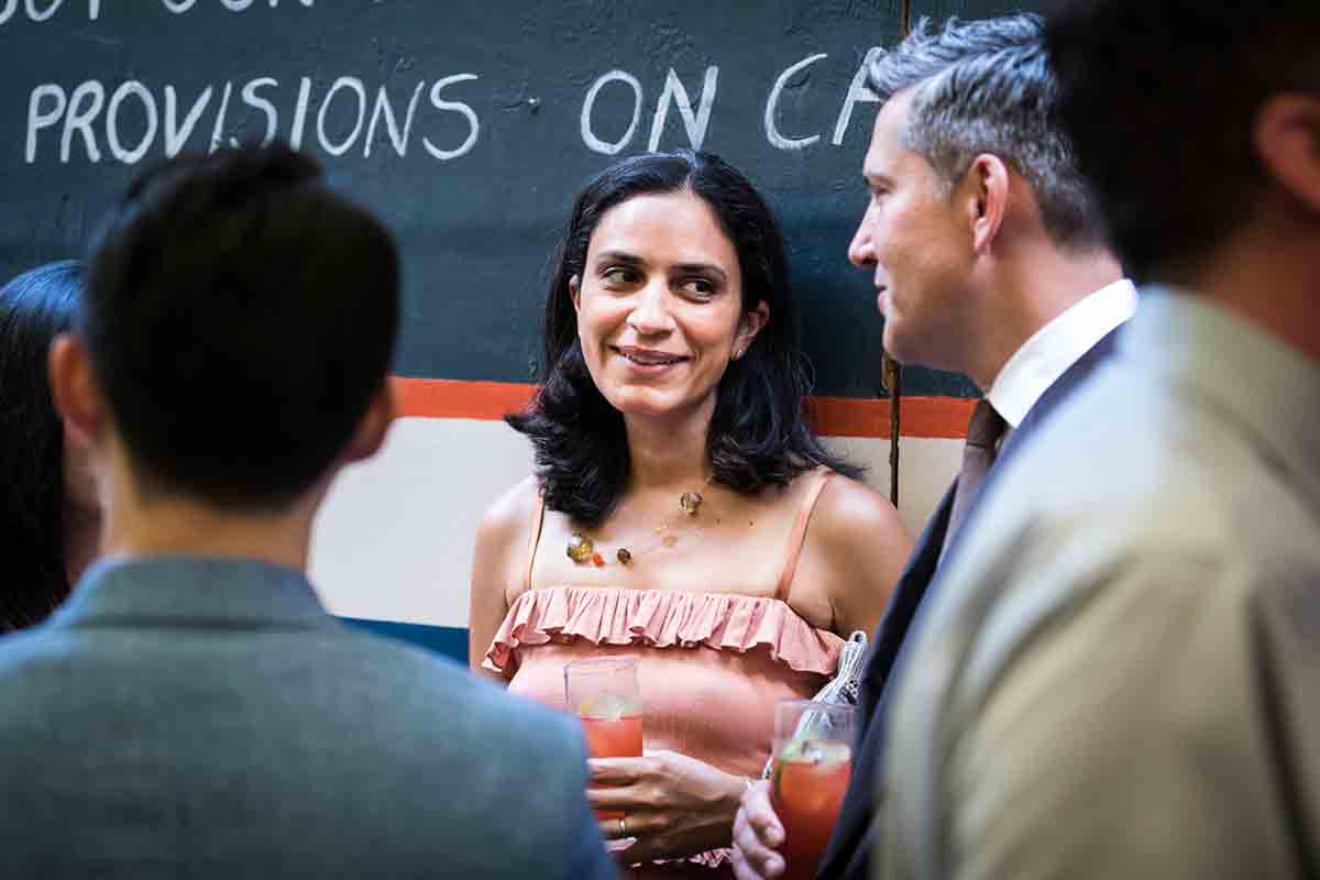 Guests chatting during wedding Il Buco Alimentari and Vineria wedding reception