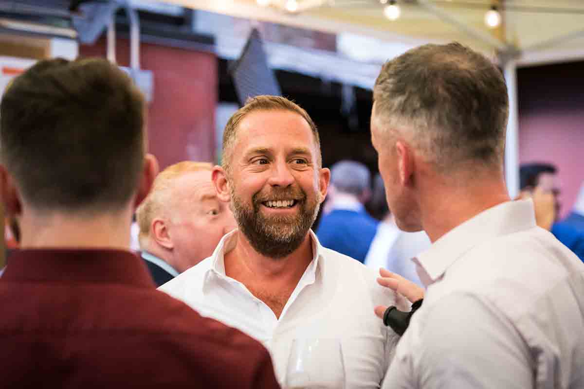 Guests smiling during wedding Il Buco Alimentari and Vineria wedding reception