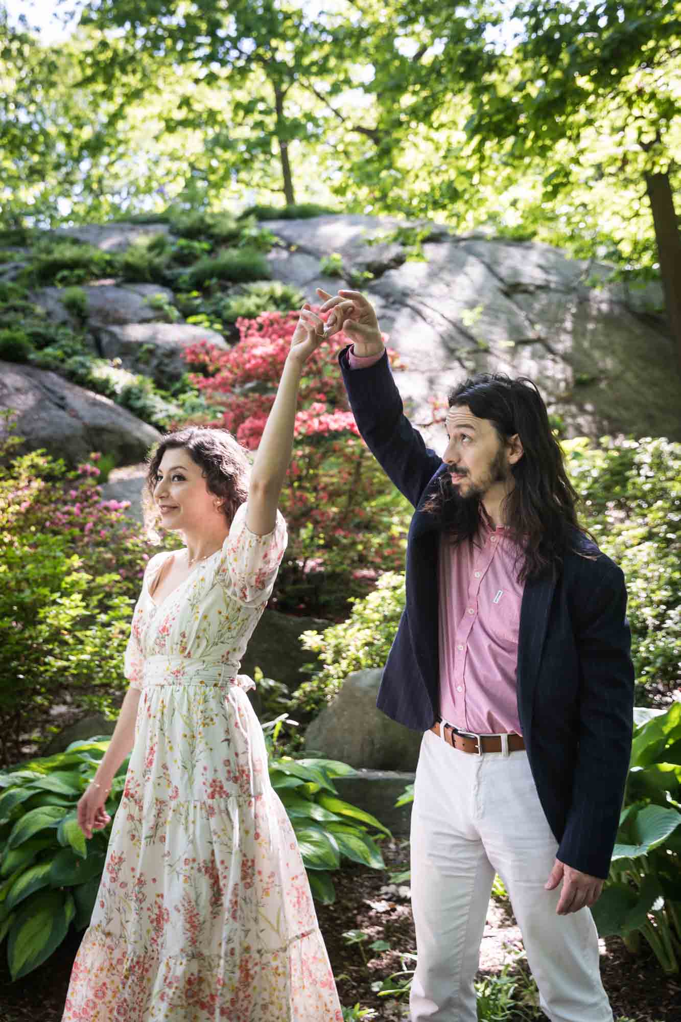 Couple dancing in front of azaleas at the New York Botanical Garden