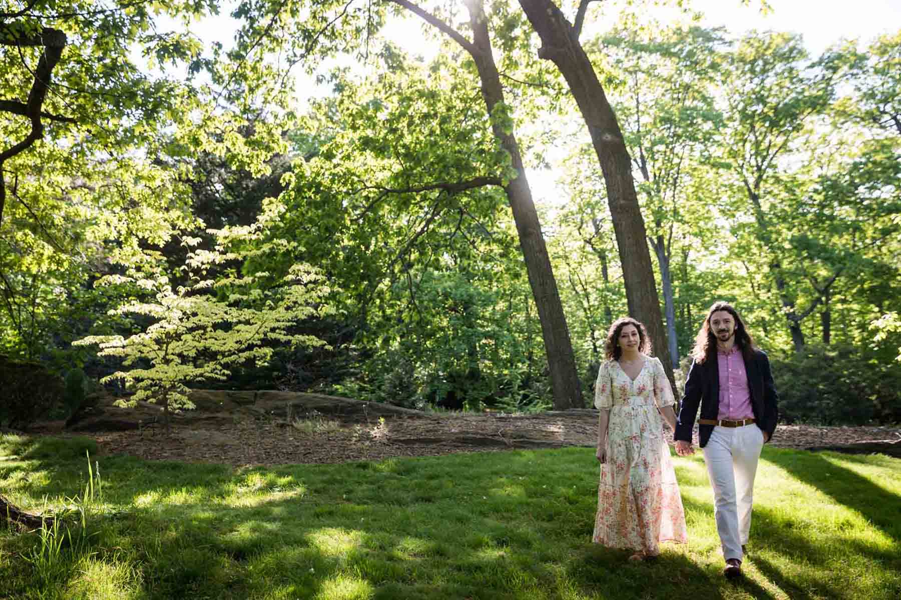 Couple walking in Conifer Collection in New York Botanical Garden