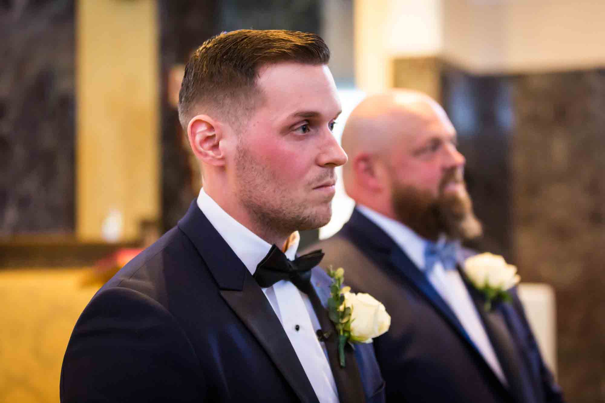 Groom in church looking to side