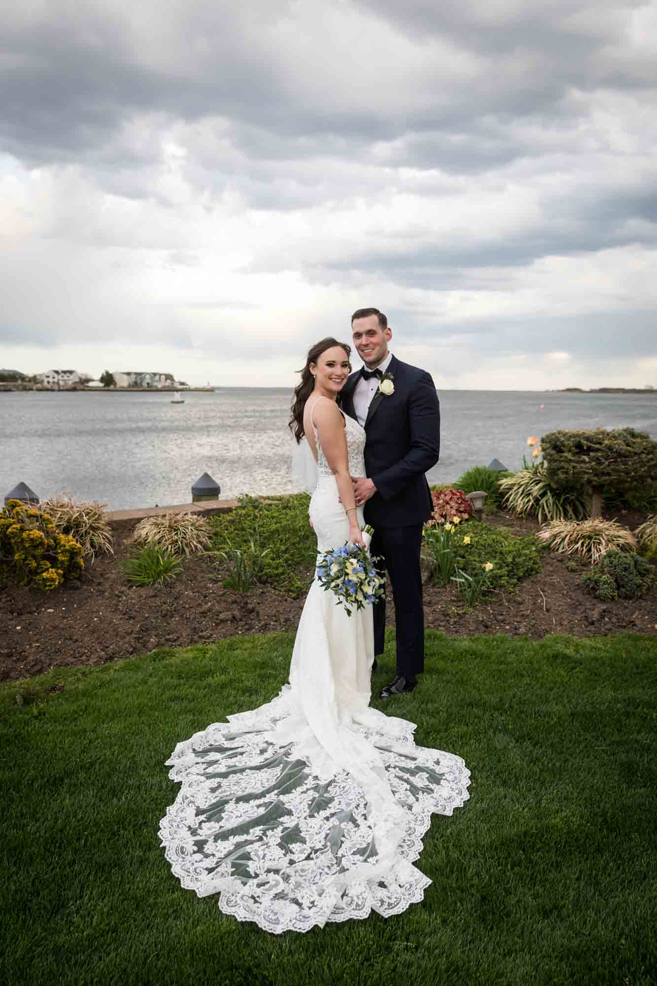 Riviera Waterfront Mansion wedding photos of bride and groom in front of South Oyster Bay