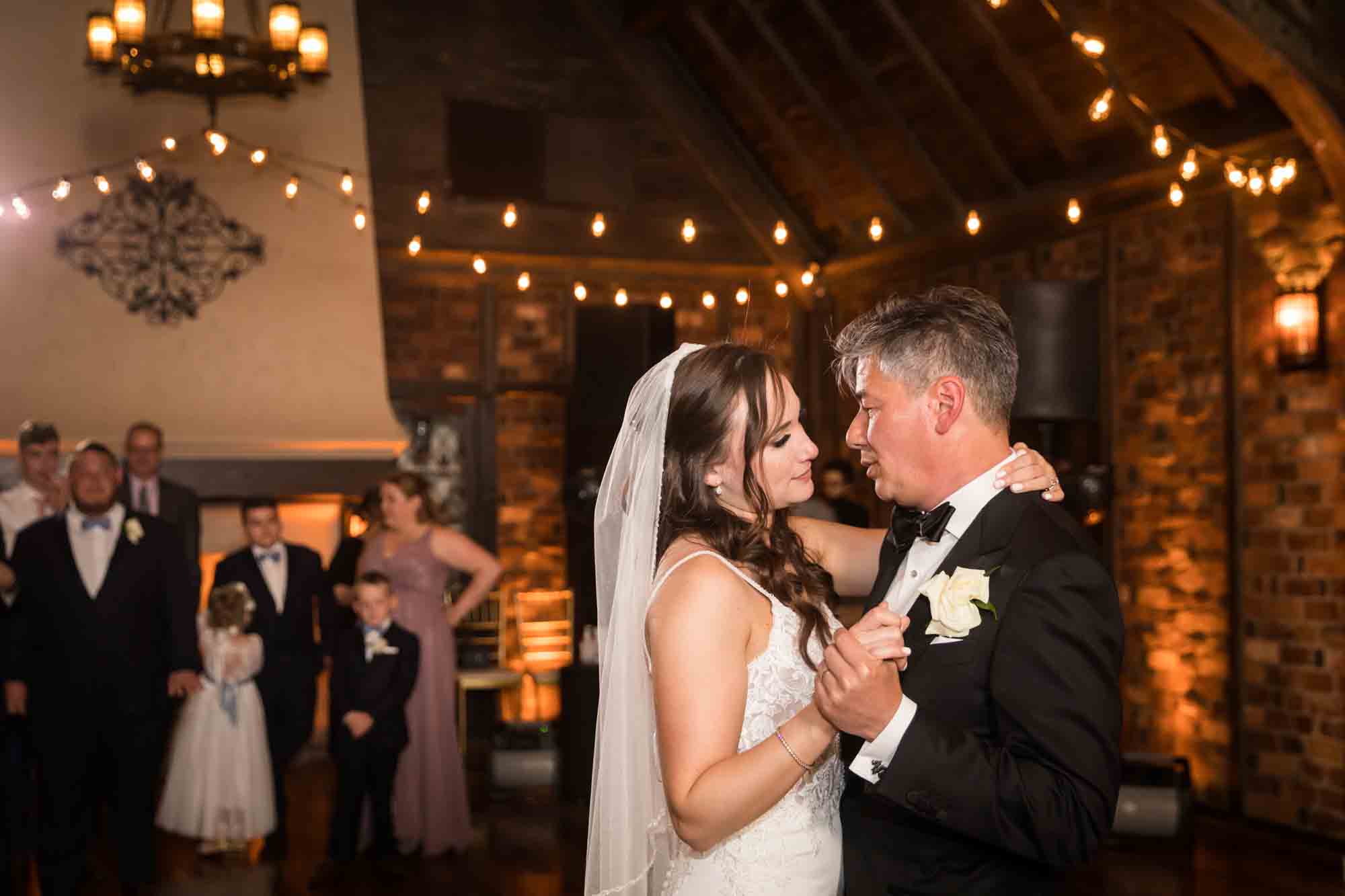 Bride dancing with father at Riviera Waterfront Mansion wedding